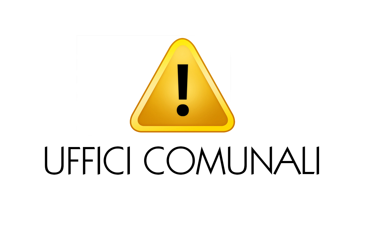 Un cartello centrale a forma di triangolo giallo con un punto esclamativo nero in mezzo e sotto la scritta in stampatello maiuscolo nero "Uffici Comunali"